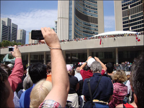 Jack Layton's casket being loaded into the hearse at Toronto City Hall